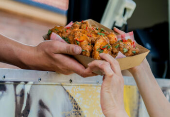 food truck customer at a food truck getting chicken wings order