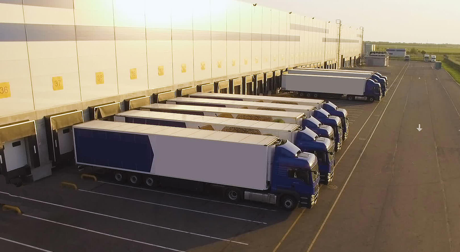 distribution warehouse with trucks awaiting loading