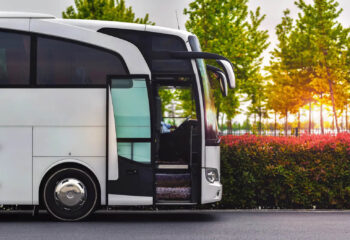 travel company bus greets tourists at the airport to take to the hotel