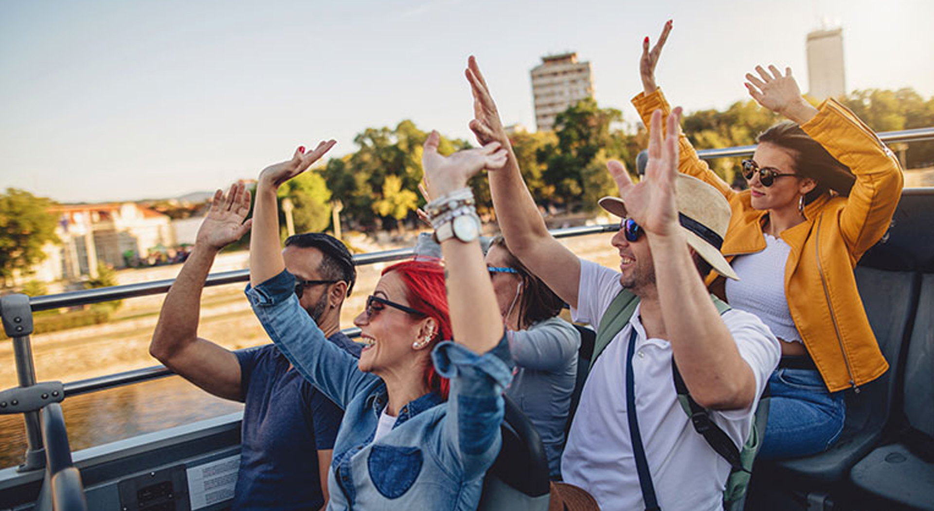 group of tourists touring a city in a party bus