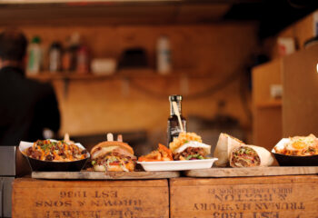 burgers and burritos being served at a food truck