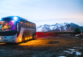 white coach bus rented as a tourist bus