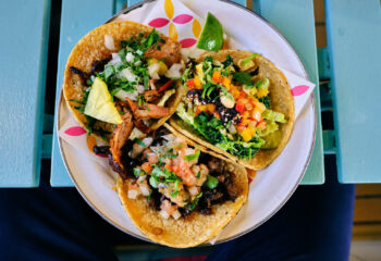 hard shell tacos served in a plate as an appetizer from a food truck