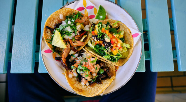 hard shell tacos served in a plate as an appetizer from a food truck