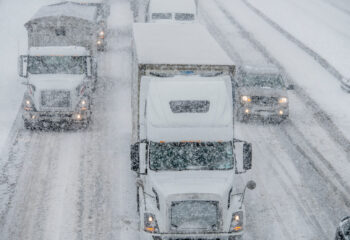 semi trucks on the road during winter