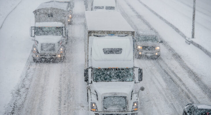 semi trucks on the road during winter