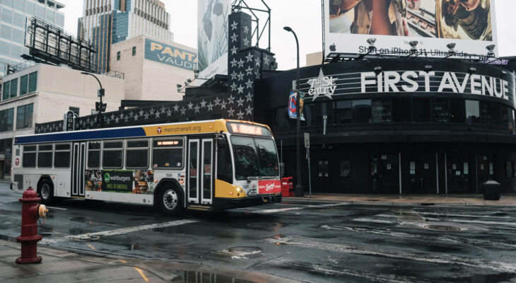 yellow and white bus on the road during daytime