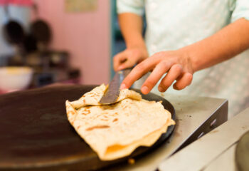 food truck personnel preparing crepe for a customer