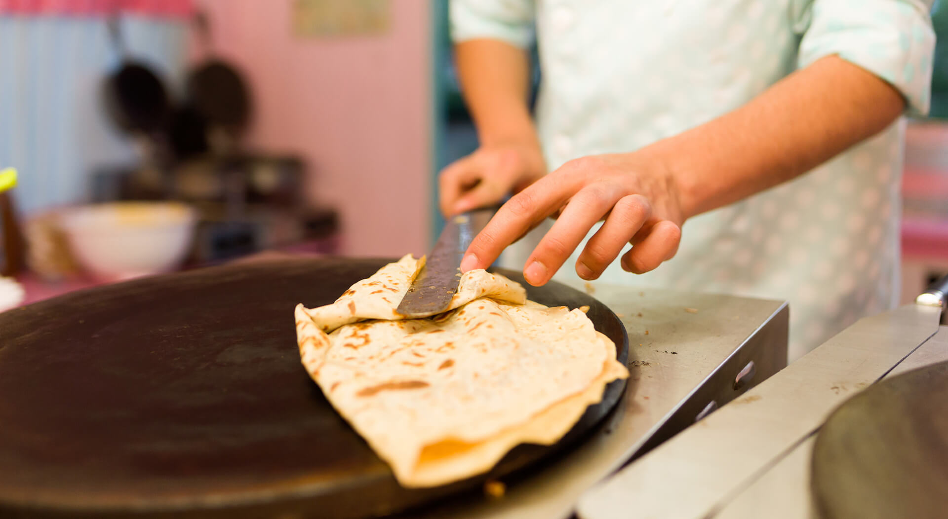 food truck personnel preparing crepe for a customer