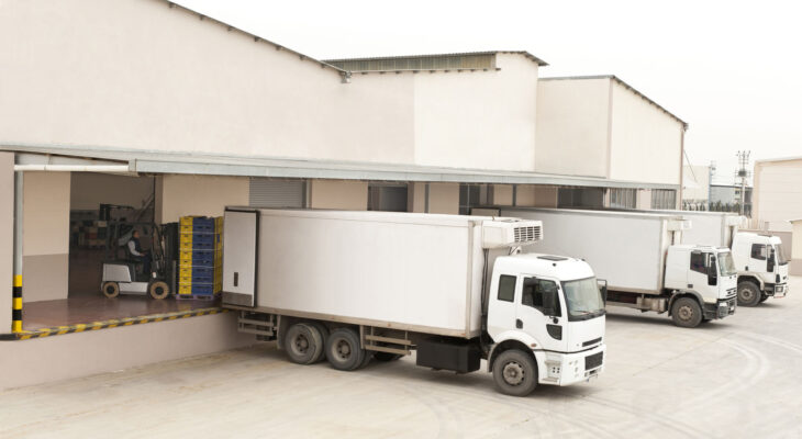 white semi truck at a truck loading dock
