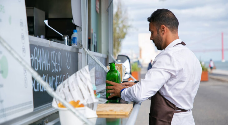 food truck server arranging bottles on the food truck counter