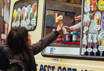 food truck customer receiving ice cream from a food truck server