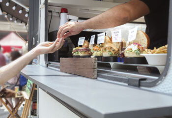 food truck server giving change to a customer
