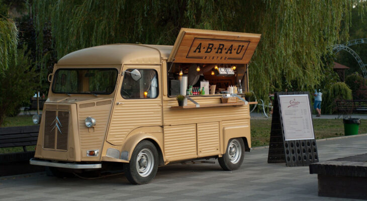 yellow food truck at a park