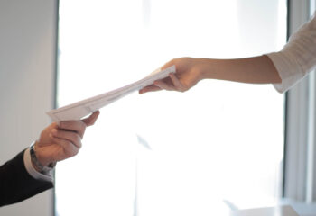 sales documents being handed to a food truck buyer