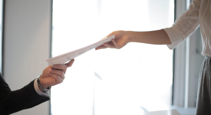 sales documents being handed to a food truck buyer