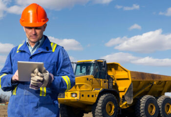 construction worker using a tablet at a construction site