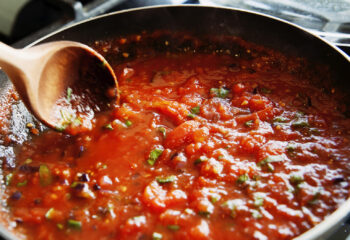 easy pasta marinara sauce being prepared in a pan