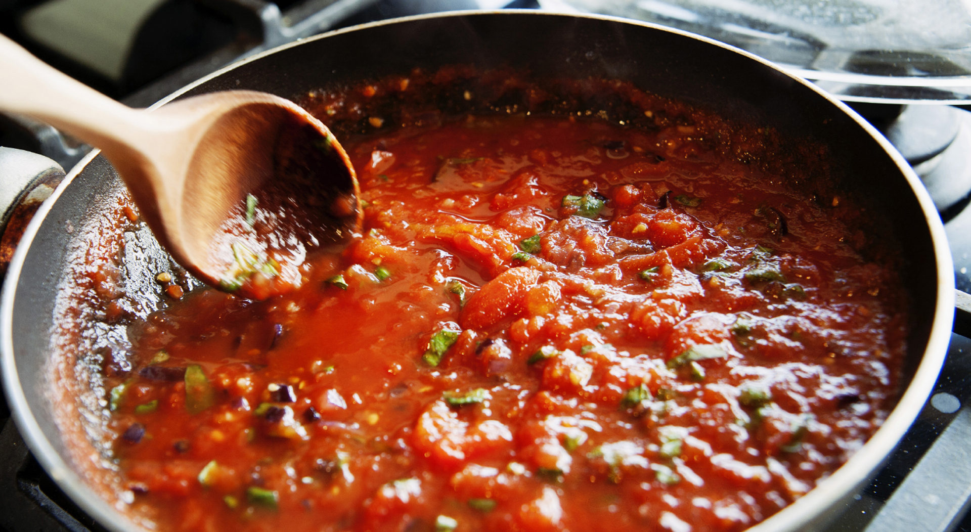 easy pasta marinara sauce being prepared in a pan