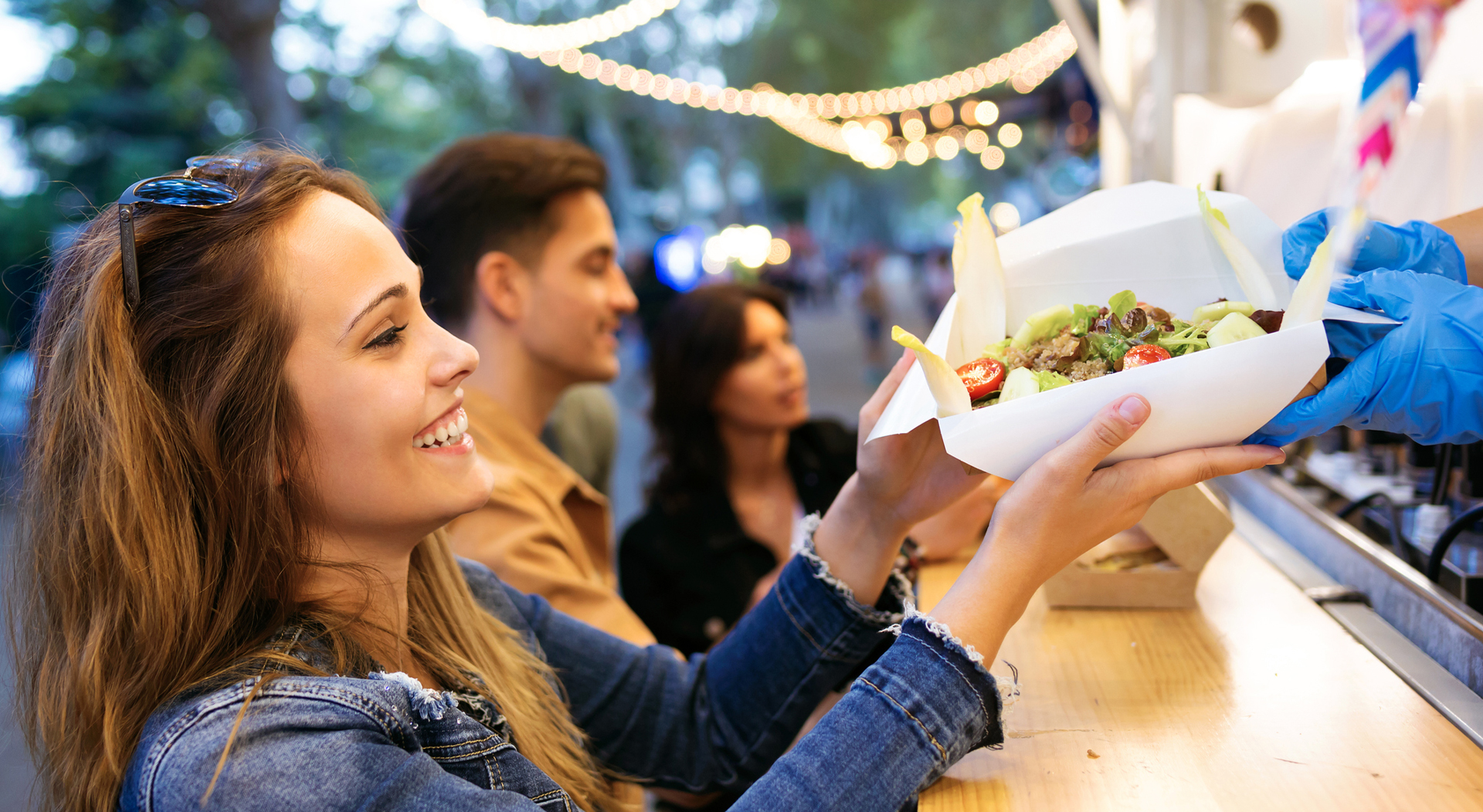 customer receiving order from a food truck