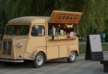 yellow food truck at a park