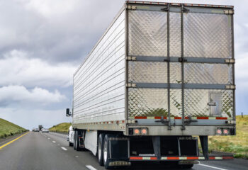 semi trailer truck on a light traffic road