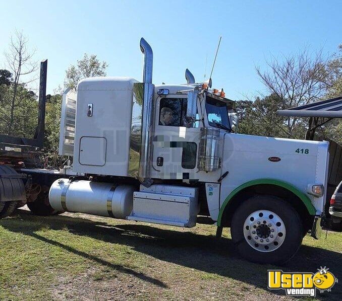 2014 Peterbilt 388 Sleeper Cab Semi Truck with a 2011 Pitts Trailer for